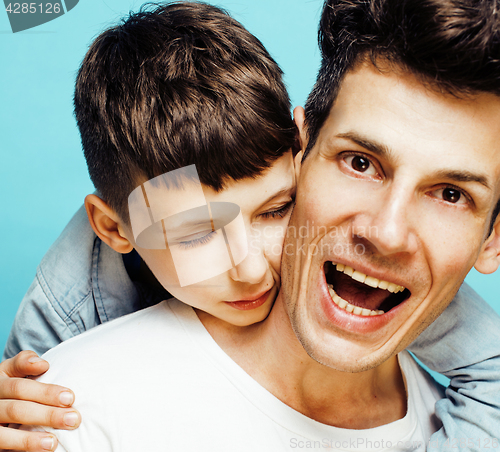 Image of young pretty man model with little cute son playing together, lifestyle modern people concept, family male 