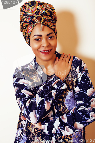 Image of beauty bright african woman with creative make up, shawl on head like cubian closeup smiling, cheerful tan mulatto, lifestyle people concept