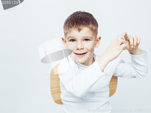 Image of young pretty little cute boy kid wondering, posing emotional face isolated on white background, gesture happy smiling close up, lifestyle real people concept