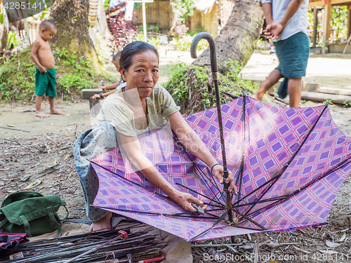 Image of Umbrella repair service in Myanmar