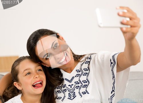 Image of Mom and Daughter making a selfie