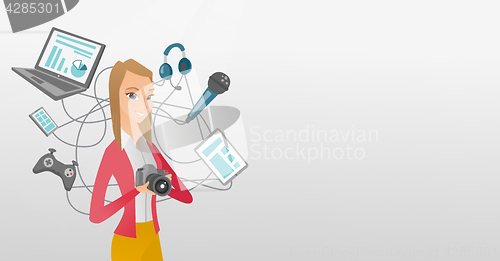 Image of Young caucasian woman surrounded by her gadgets.