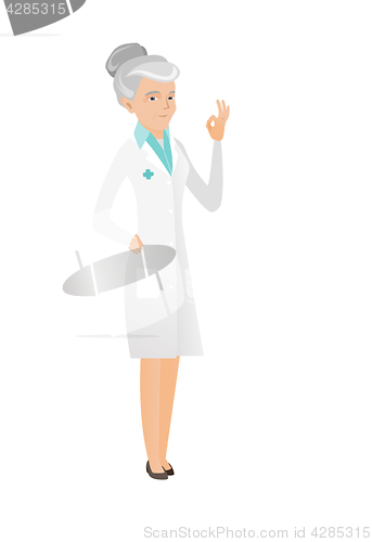Image of Senior caucasian doctor showing ok sign.
