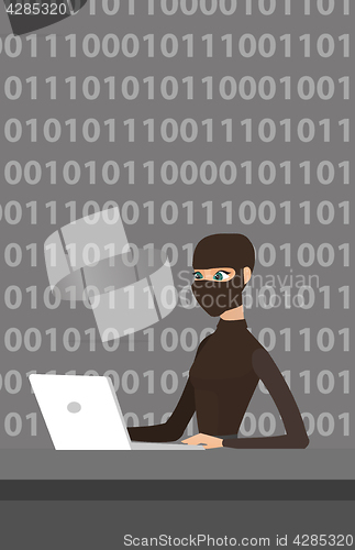 Image of Hacker using laptop to steal information.