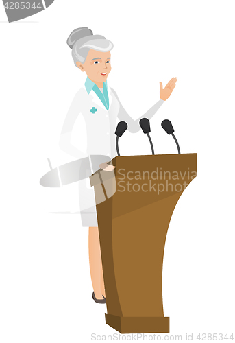 Image of Caucasian doctor giving a speech from tribune.