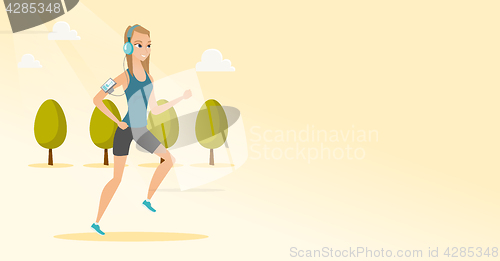 Image of Young man running with earphones and smartphone.