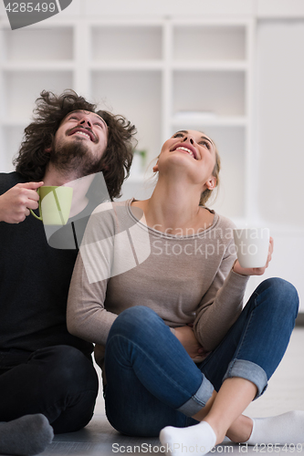 Image of young couple in their new home