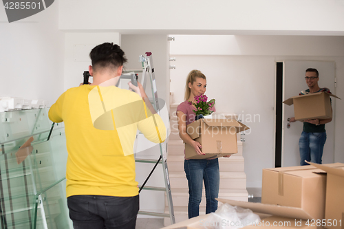 Image of young couple moving into a new home