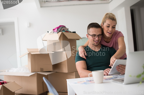 Image of Young couple moving in a new home