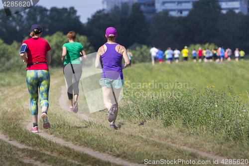 Image of Group of young people on Outdoor cross-country running marathon