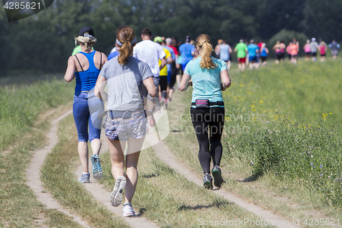 Image of Group of young people on Outdoor cross-country running marathon