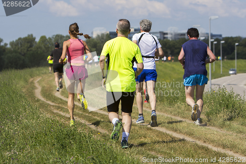 Image of Group of young people on Outdoor cross-country running marathon