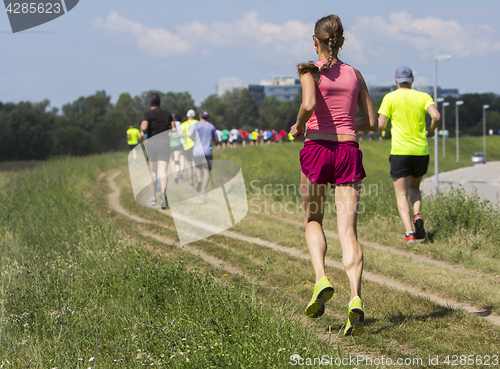 Image of Group of young people on Outdoor cross-country running marathon