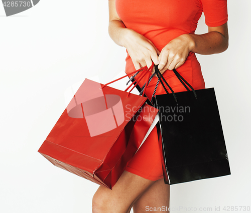 Image of woman with diverse bags  posing emotional on white background, sale, lifestyle people concept