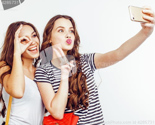 Image of best friends teenage girls together having fun, posing emotional on white background, besties happy smiling, lifestyle people concept close up