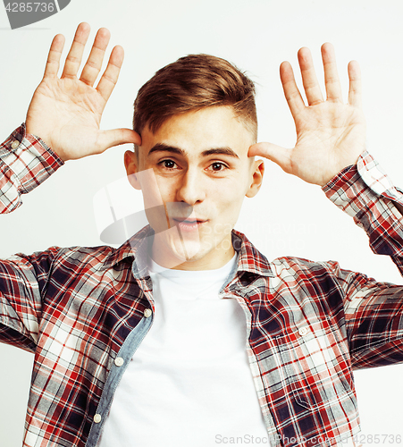 Image of young handsome teenage hipster guy posing emotional, happy smiling against white background isolated, lifestyle people concept 