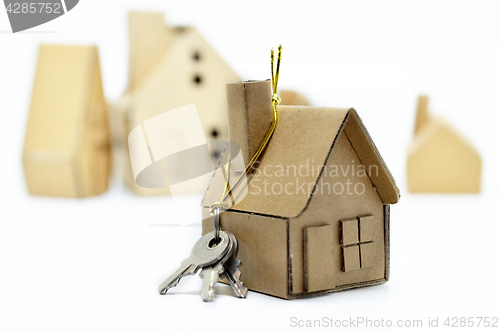 Image of House of paper and metal key