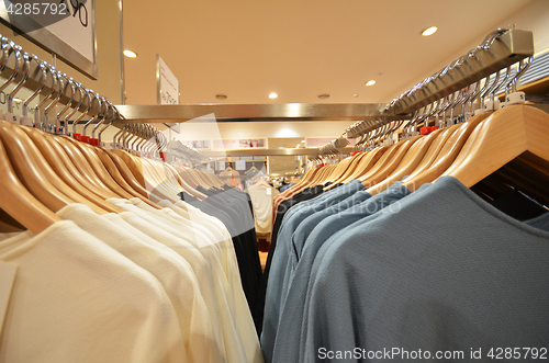 Image of Designer clothes hanger in a row
