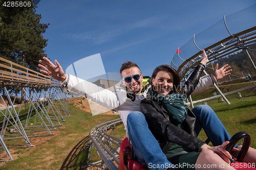 Image of couple enjoys driving on alpine coaster