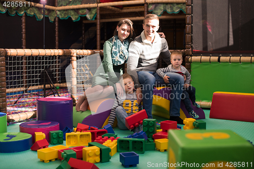 Image of parents having fun with kids