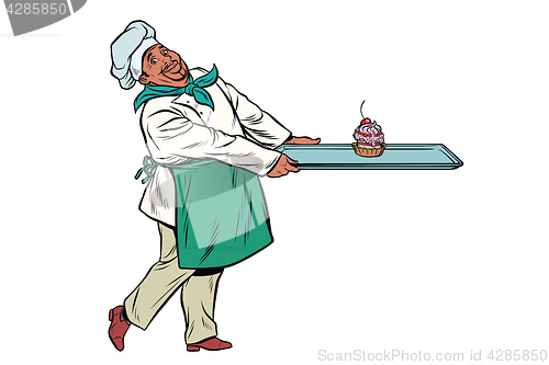 Image of African Chef cook brings a tray of dessert cupcake