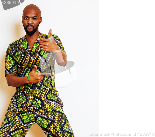 Image of portrait of young handsome african man wearing bright green nati