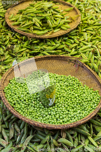 Image of Green peas, Pisum sativum, being sold at local food market.