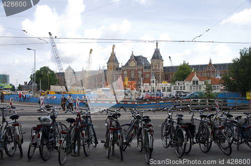 Image of editorial commuter bicycles parked near centraal station amsterd