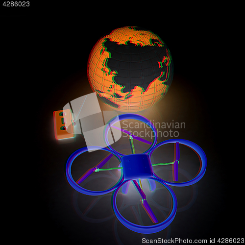 Image of Quadrocopter Drone with Earth Globe and remote controller on a w