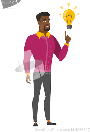 Image of Businessman pointing at business idea light bulb.