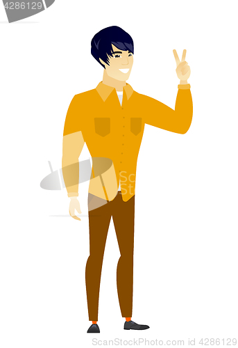 Image of Asian businessman showing the victory gesture.