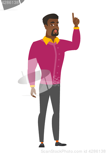 Image of Businessman with open mouth pointing finger up.