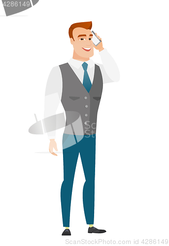 Image of Businessman talking on a mobile phone.