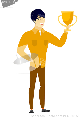 Image of Asian business man holding a trophy.