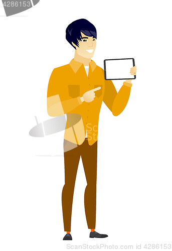 Image of Smiling businessman holding tablet computer.