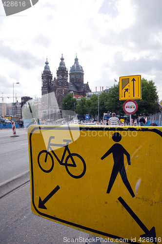 Image of sign amsterdam bicycle side and pedestrain side of street