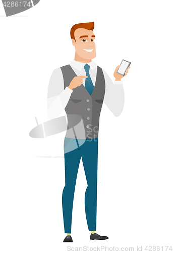 Image of Caucasian business man holding a mobile phone.