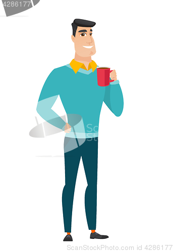 Image of Young caucasian businessman holding cup of coffee.