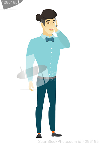 Image of Businessman talking on a mobile phone.