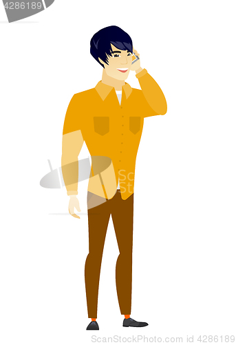 Image of Businessman talking on a mobile phone.