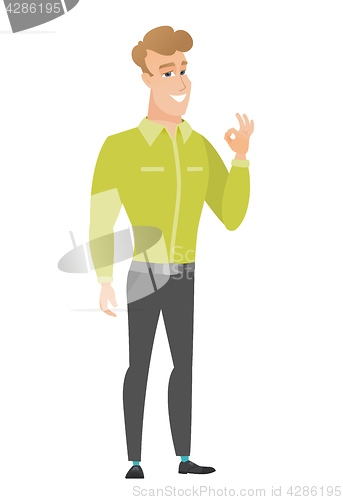 Image of Smiling businessman showing ok sign.