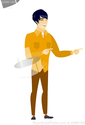 Image of Young asian businessman pointing to the side.