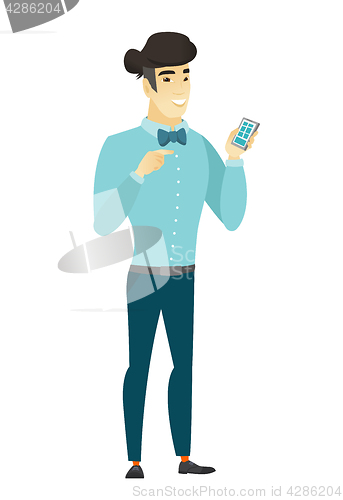 Image of Asian business man holding a mobile phone.