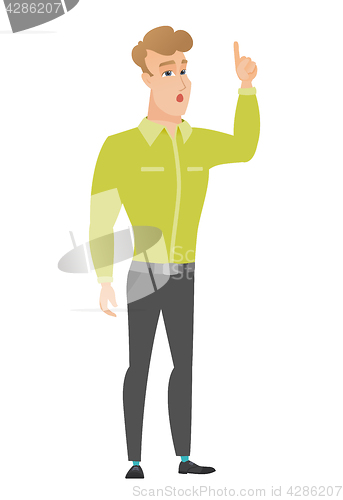 Image of Businessman with open mouth pointing finger up.