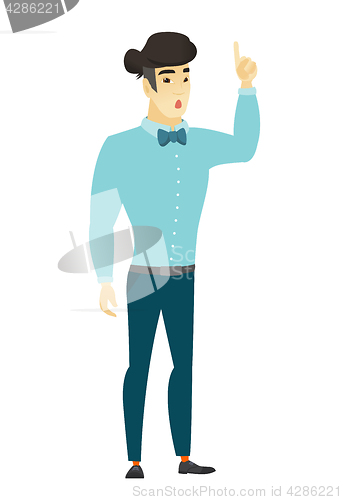 Image of Businessman with open mouth pointing finger up.