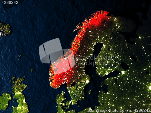 Image of Norway in red from space at night