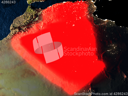 Image of Algeria in red from space at night
