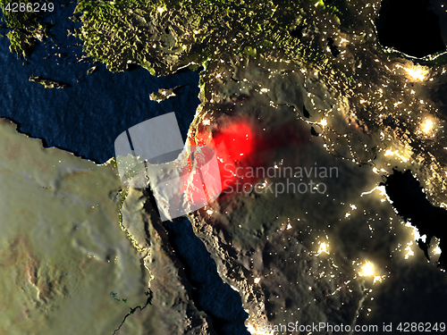 Image of Jordan in red from space at night