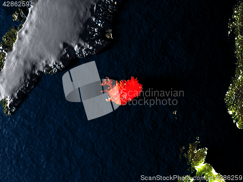 Image of Iceland in red from space at night