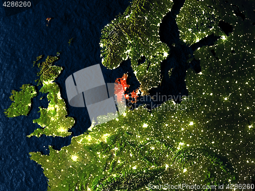 Image of Denmark in red from space at night